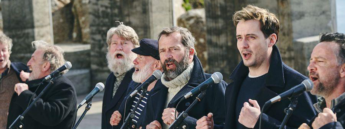 The group Fisherman's Friends sing in Fisherman's Friends: One And All