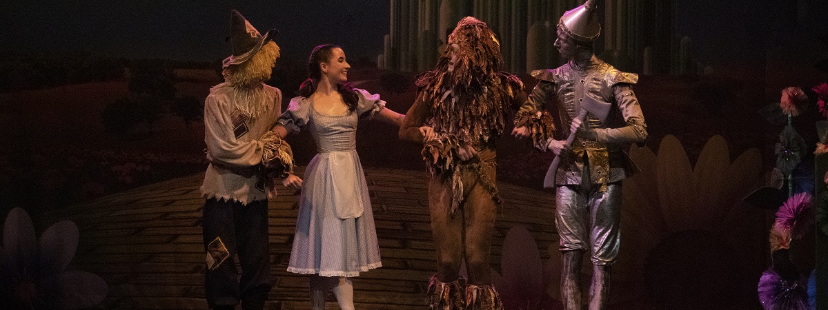 The scarecrow, Dorothy, lion and tin man in Ballet Theatre UK's The Wizard of Oz