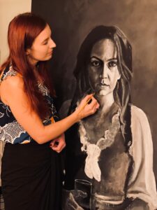 Artist Jilly Johnson paints a portrait of Elsie Marley.