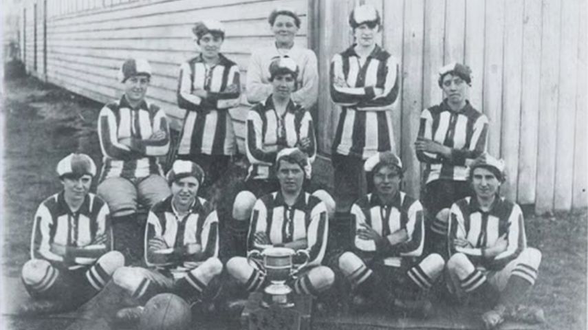 A photograph of cup winners in a promotional image for Wor Bella.
